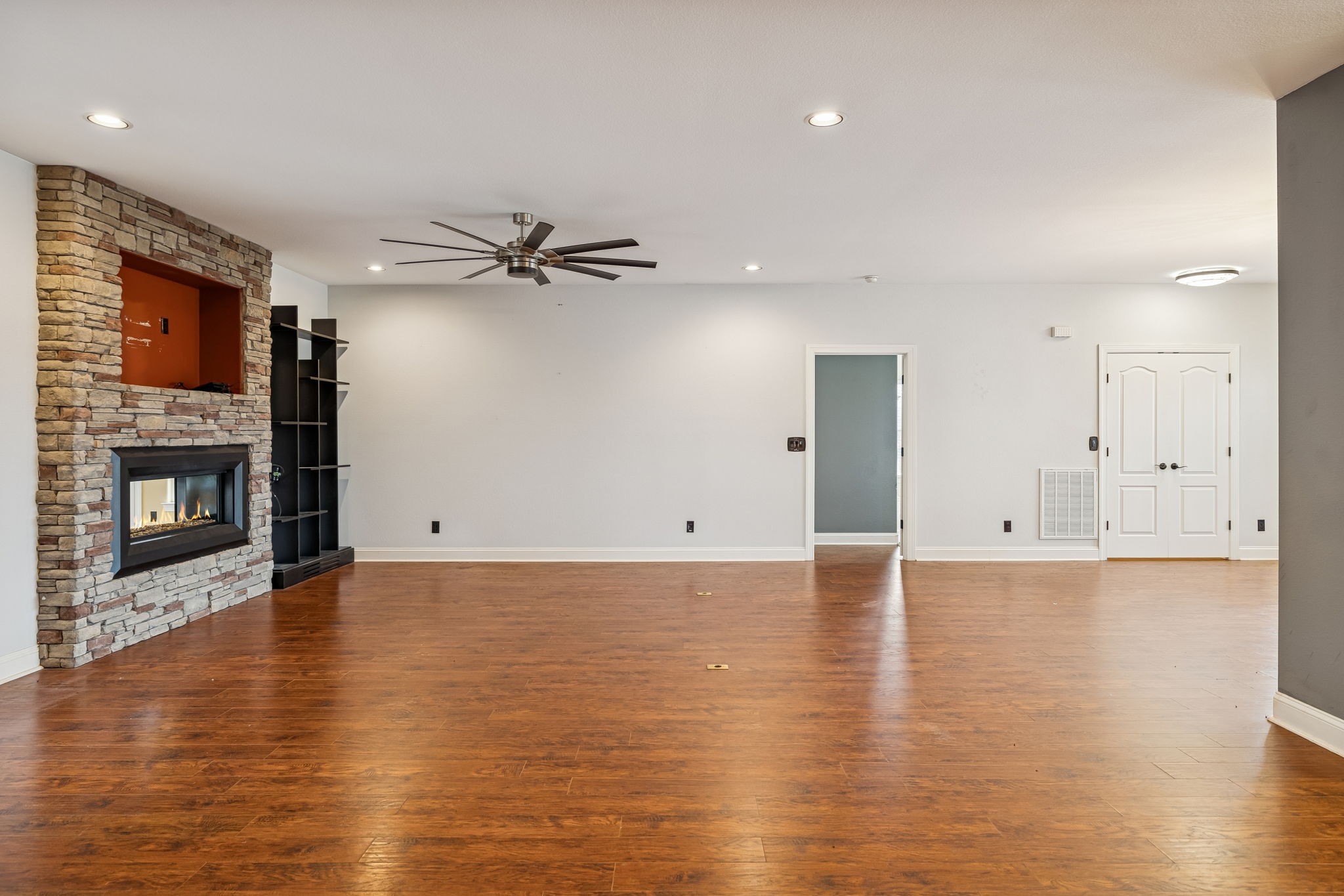 1970 Corinth Road Mount Juliet, TN 37122 - Photo 32 of 71 a view of an empty room with wooden floor and a fireplace