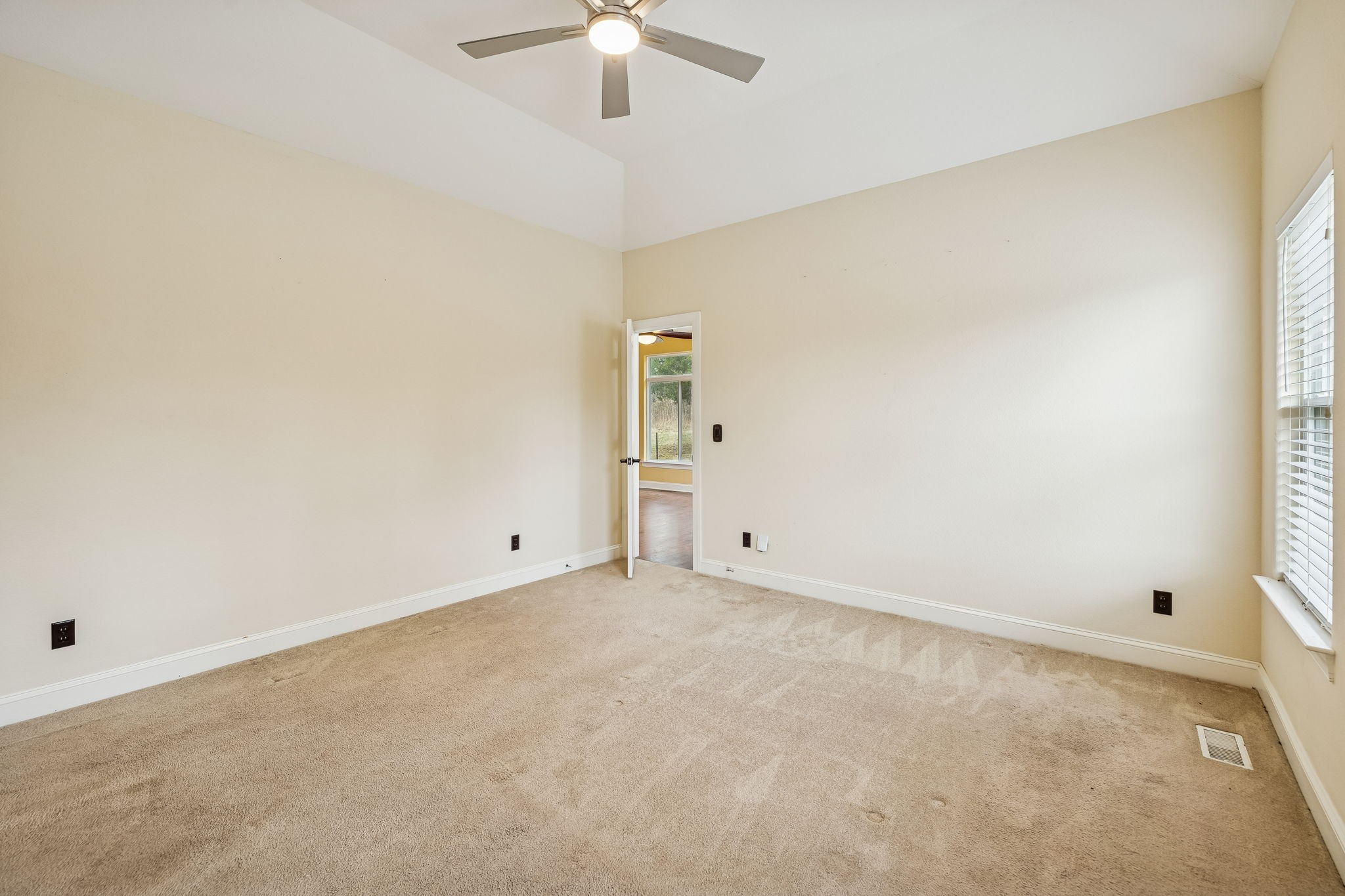 1970 Corinth Road Mount Juliet, TN 37122 - Photo 37 of 71 an empty room with chandelier fan and windows