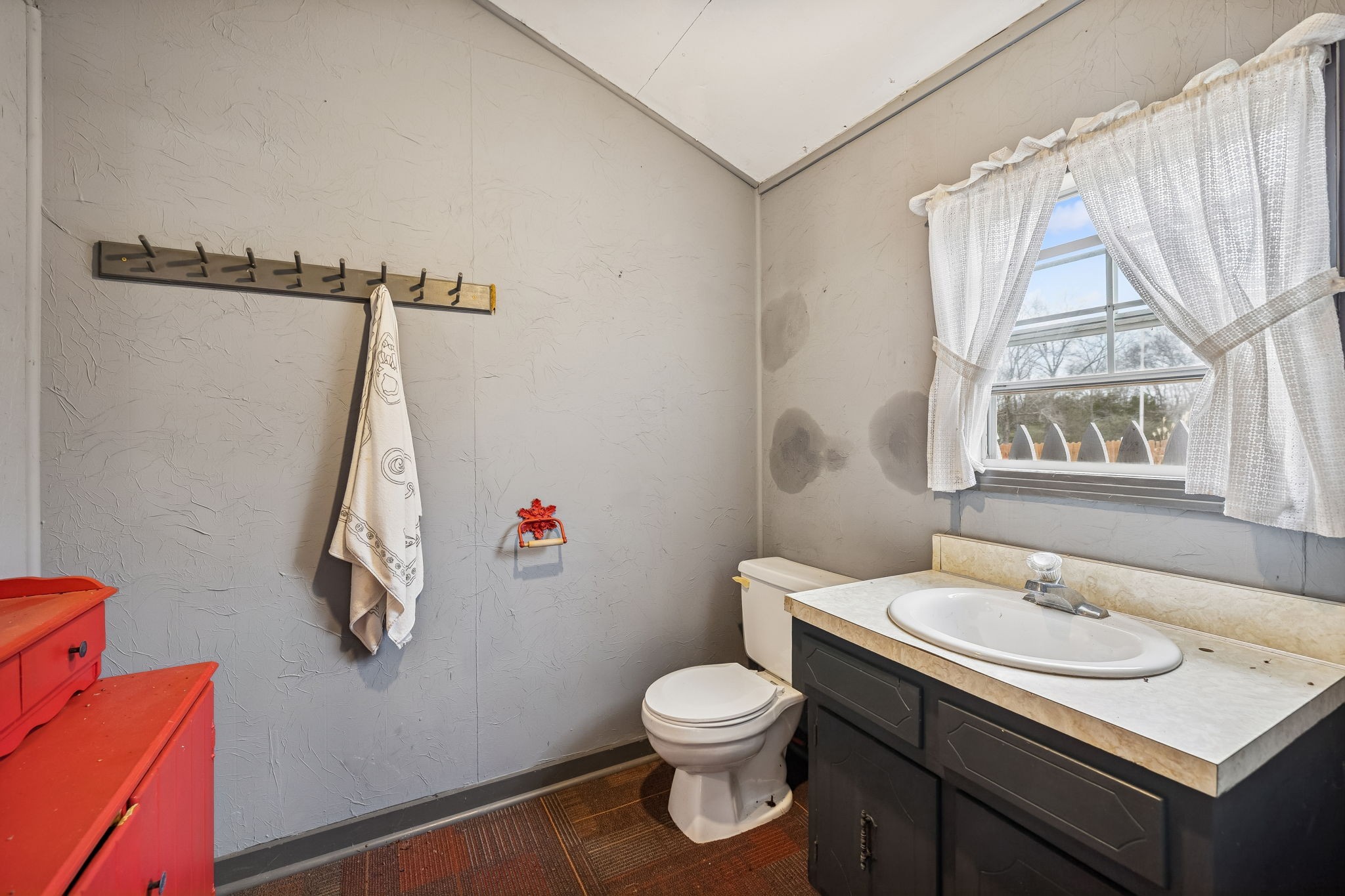 1970 Corinth Road Mount Juliet, TN 37122 - Photo 58 of 71 a bathroom with a sink toilet and a window