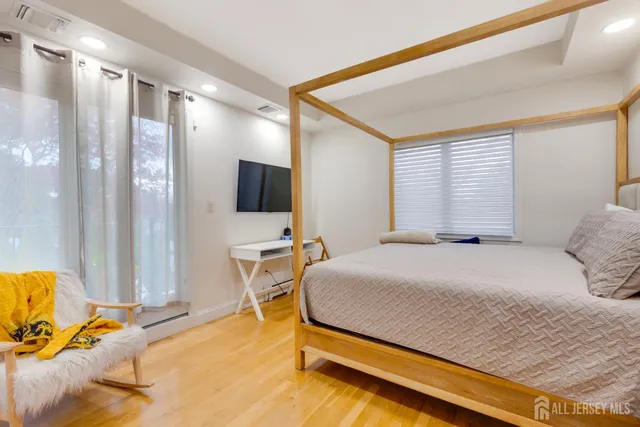 a bedroom with a bed and glass table