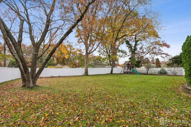 a view of outdoor space with deck and trees