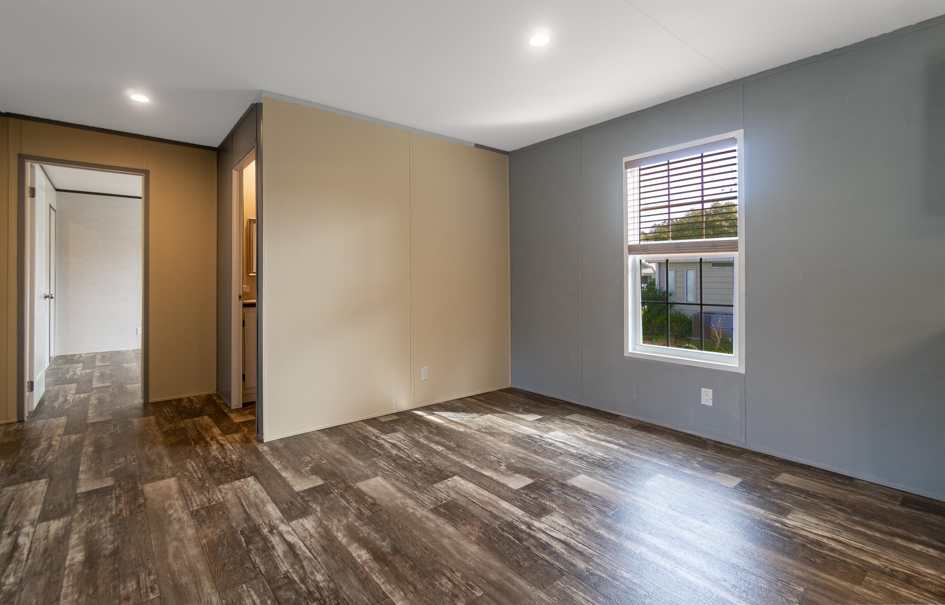 102 Pinelake Drive Satsuma, FL 32189 - Photo 11 of 35 wooden floor in an empty room with a window