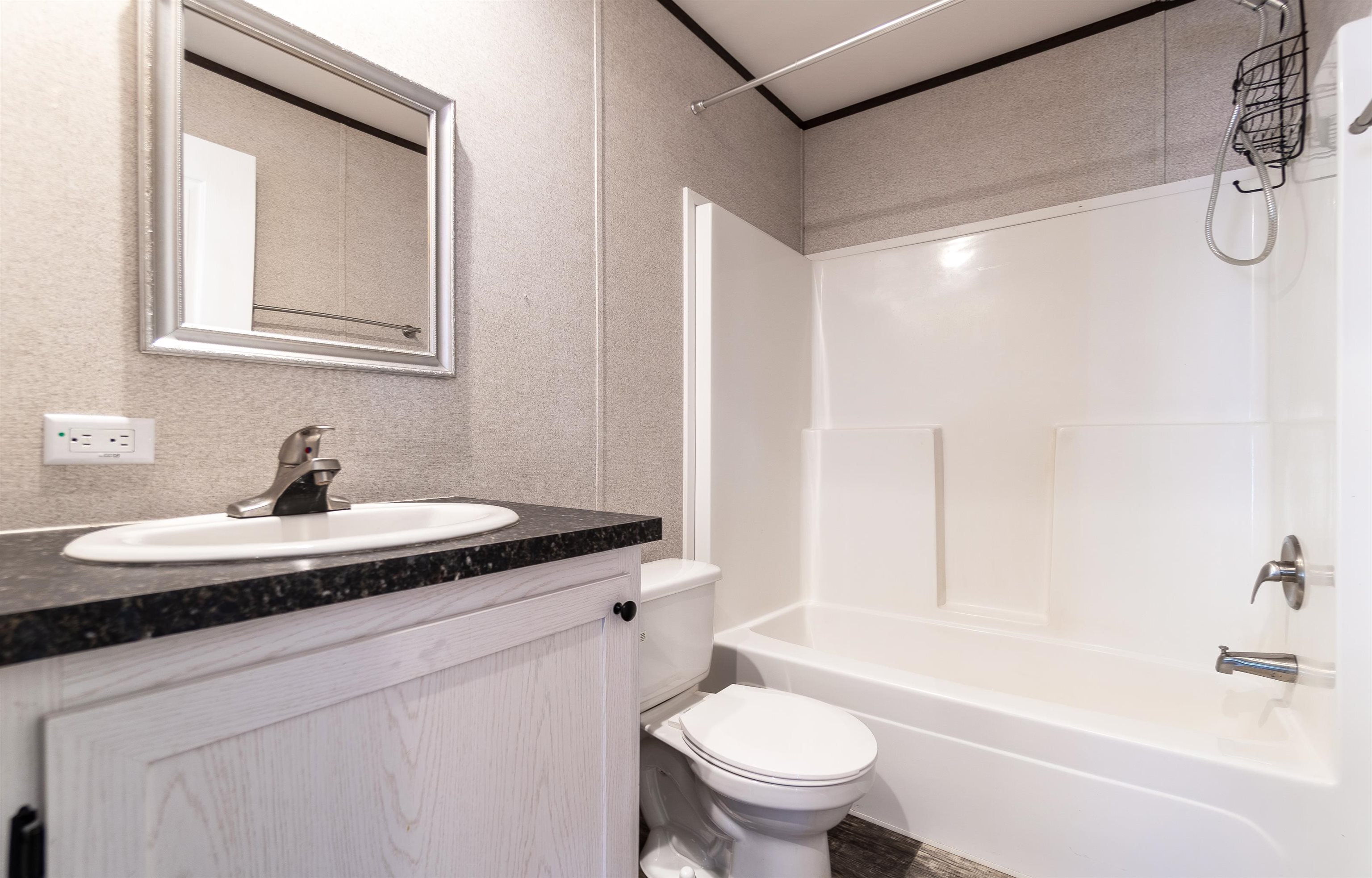 102 Pinelake Drive Satsuma, FL 32189 - Photo 13 of 35 a bathroom with a granite countertop sink toilet and a mirror