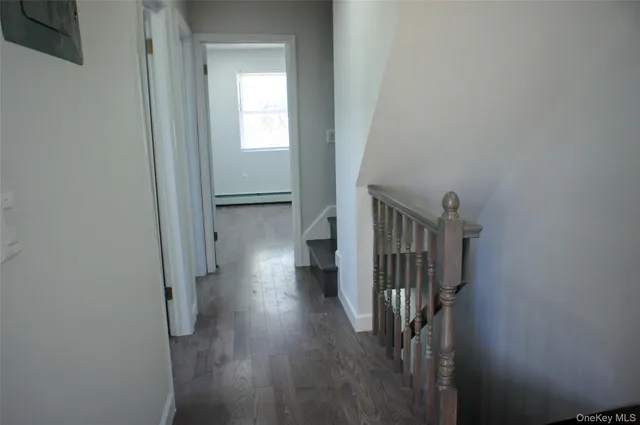 a view of entryway with wooden floor