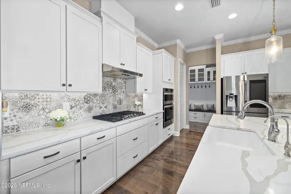 a utility room with sink dryer and washer