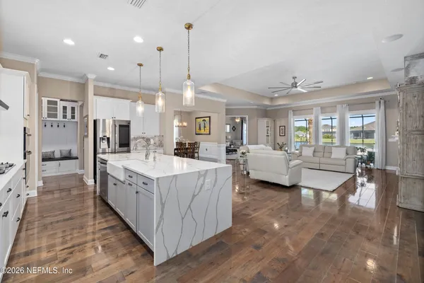 a view of walk in closet with clothes