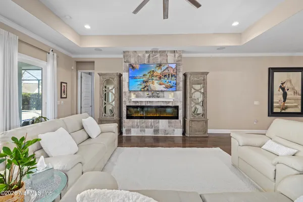 an aerial view of a swimming pool playground and residential houses with outdoor space
