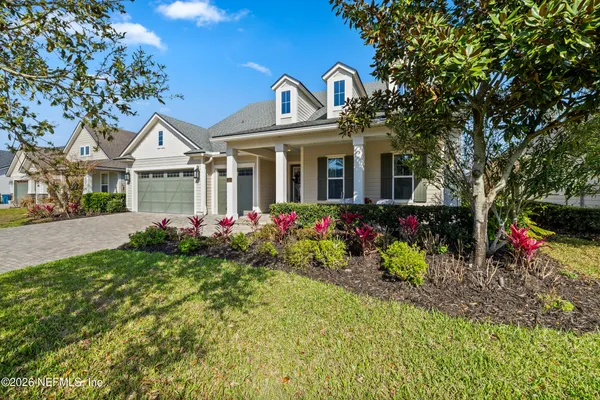 a view of swimming pool with a lounge chairs