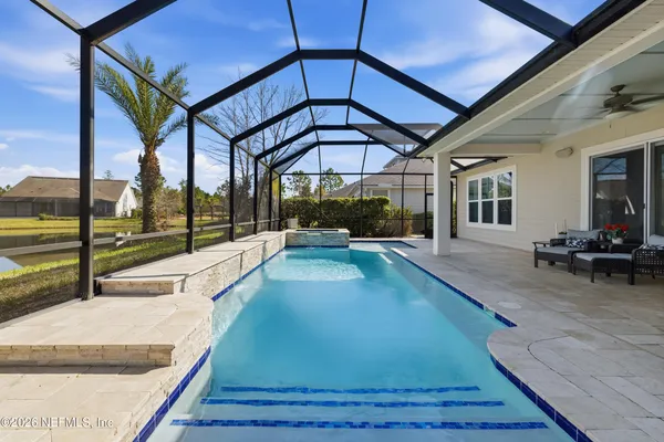 a view of a swimming pool with a yard