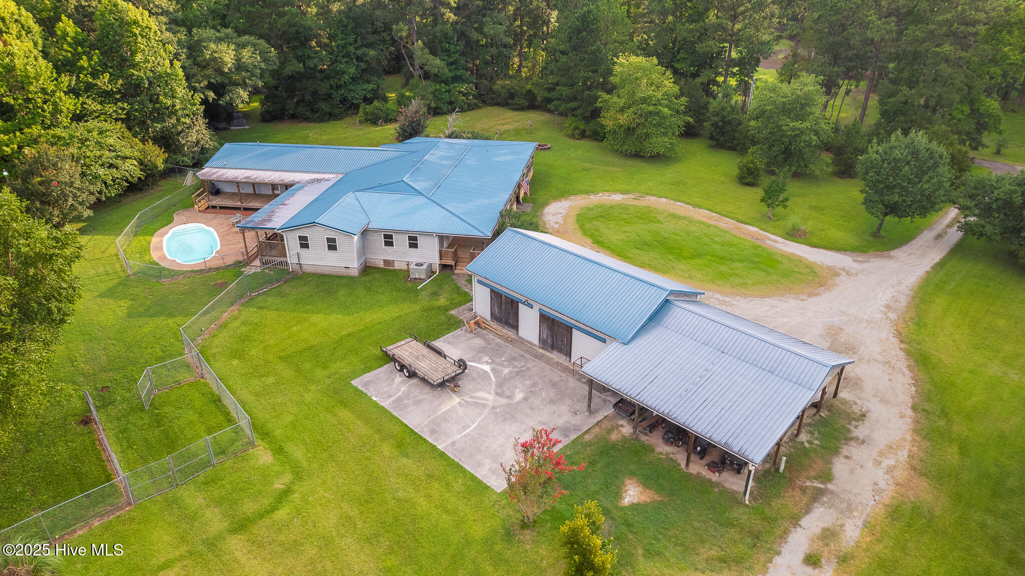 161 Howard Lane Swansboro, NC 28584 - Photo 8 of 56 Residence with backyard saltwater pool in upper left, detached garage/workshop and carport in foreground