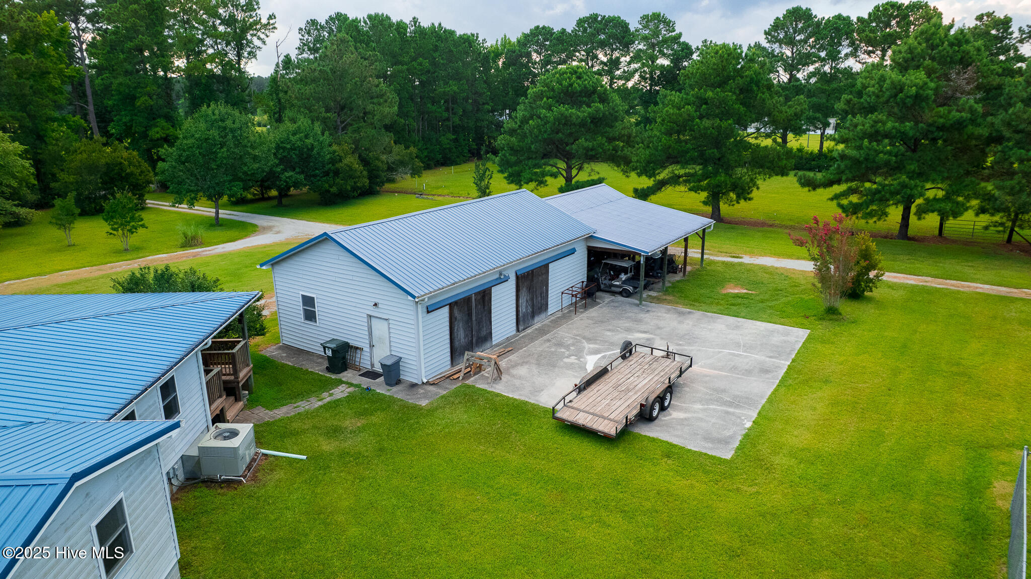 161 Howard Lane Swansboro, NC 28584 - Photo 9 of 56 Two bay doors, concrete pad and carport enhance the functionality of the detached garage/workshop. Wired to support horse trailers and RVs.