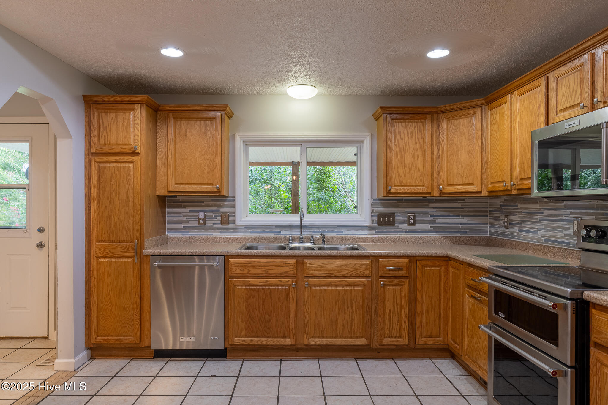 161 Howard Lane Swansboro, NC 28584 - Photo 13 of 56 Matching KitchenAid appliances and solid wood cabinetry.