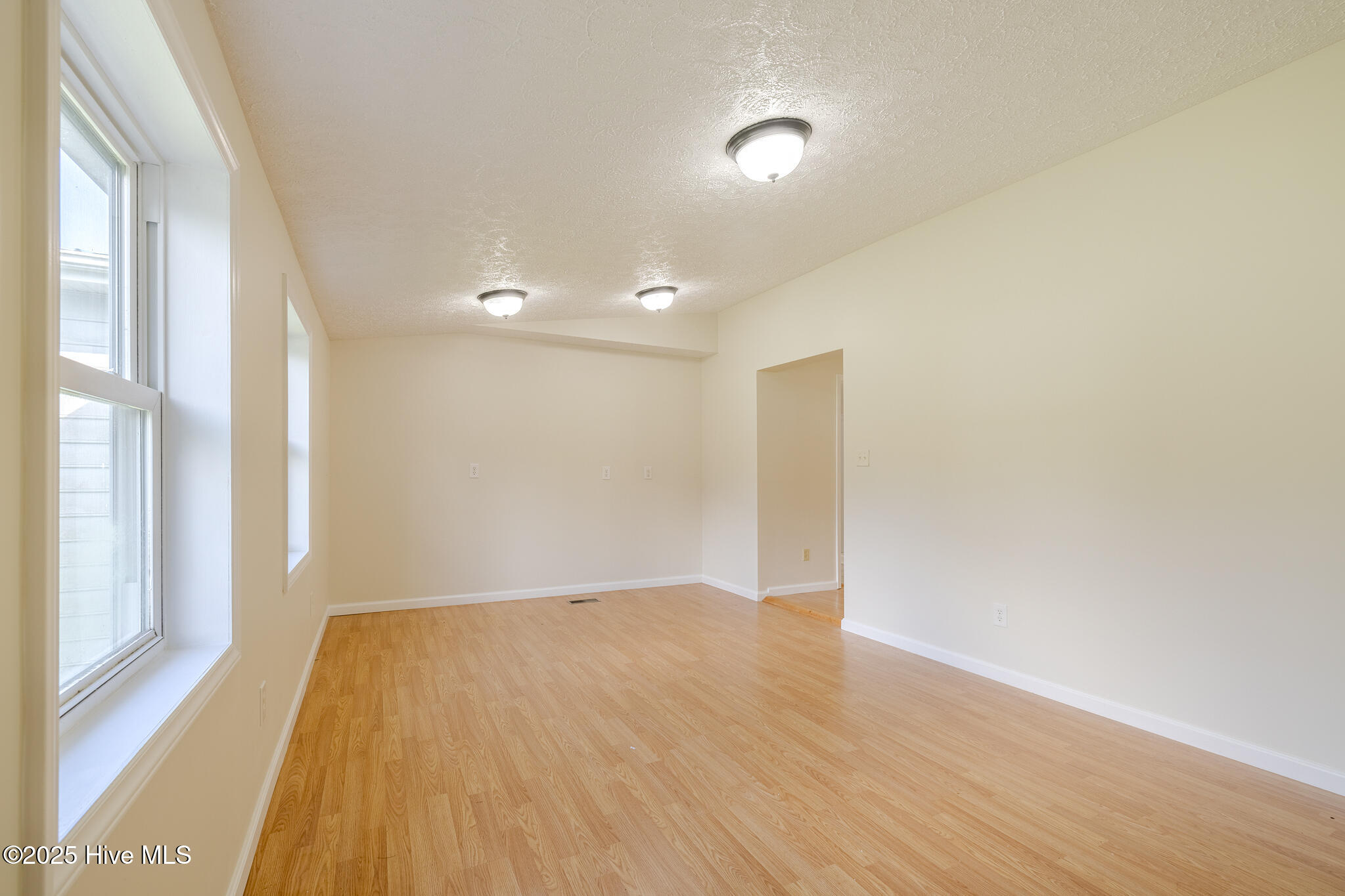 161 Howard Lane Swansboro, NC 28584 - Photo 15 of 56 Living room for mother-in-law (MIL) suite. Countertop-level electrical outlets set to accommodate installation of kitchenette.