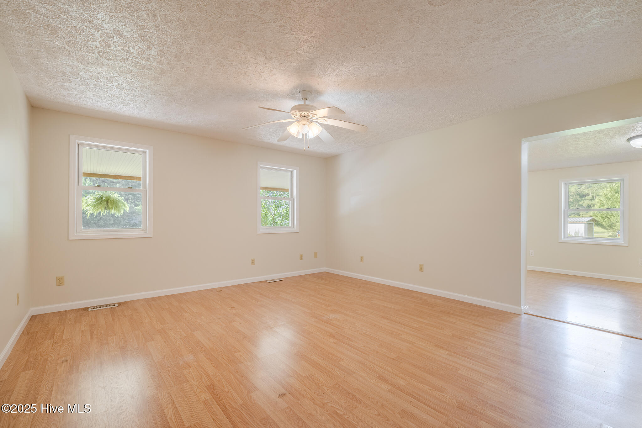 161 Howard Lane Swansboro, NC 28584 - Photo 17 of 56 Bedroom for mother-in-law (MIL) suite with living room entryway on right.