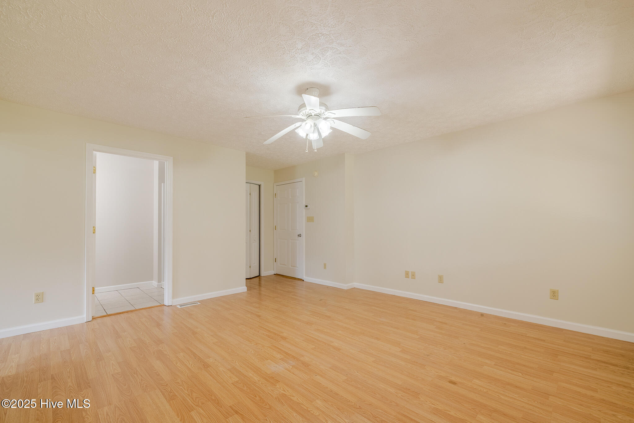 161 Howard Lane Swansboro, NC 28584 - Photo 18 of 56 Mother-in-law suite bedroom, looking at bathroom and closet doors.
