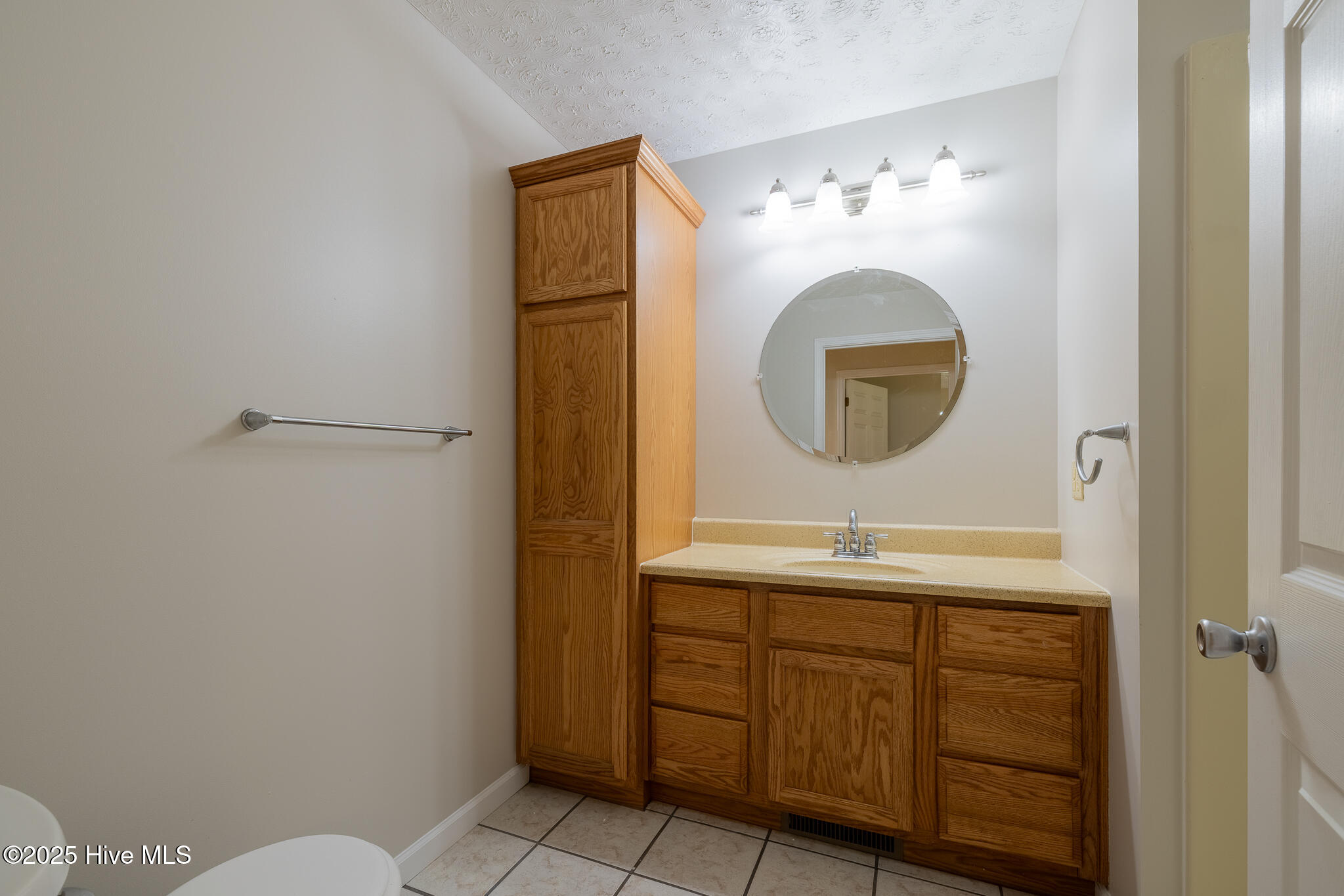161 Howard Lane Swansboro, NC 28584 - Photo 19 of 56 Mother-in-law suite bathroom with solid wood cabinetry