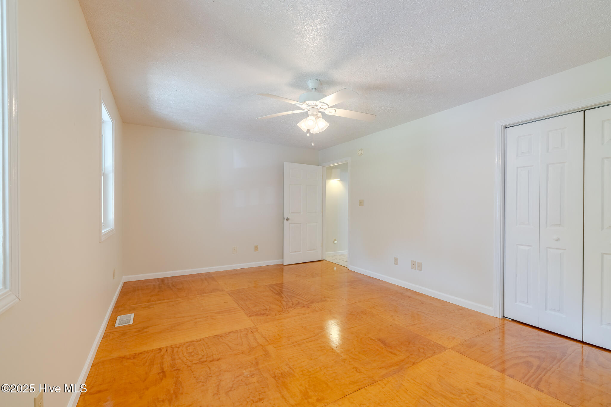 161 Howard Lane Swansboro, NC 28584 - Photo 20 of 56 Bonus room with lacquered wood floor is located along front of house.