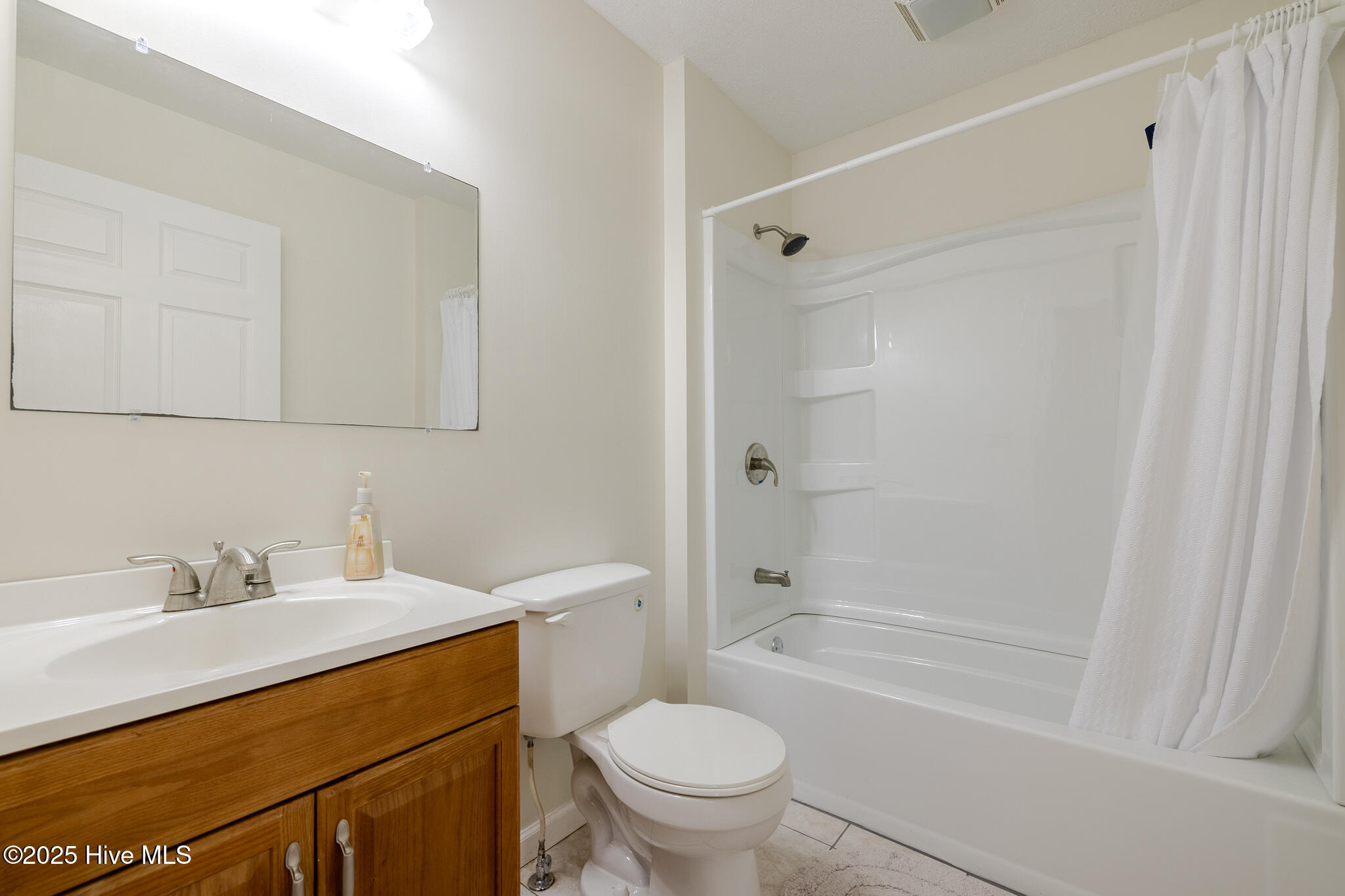161 Howard Lane Swansboro, NC 28584 - Photo 21 of 56 Bathroom accessed through back foyer serves large tiled guest room.