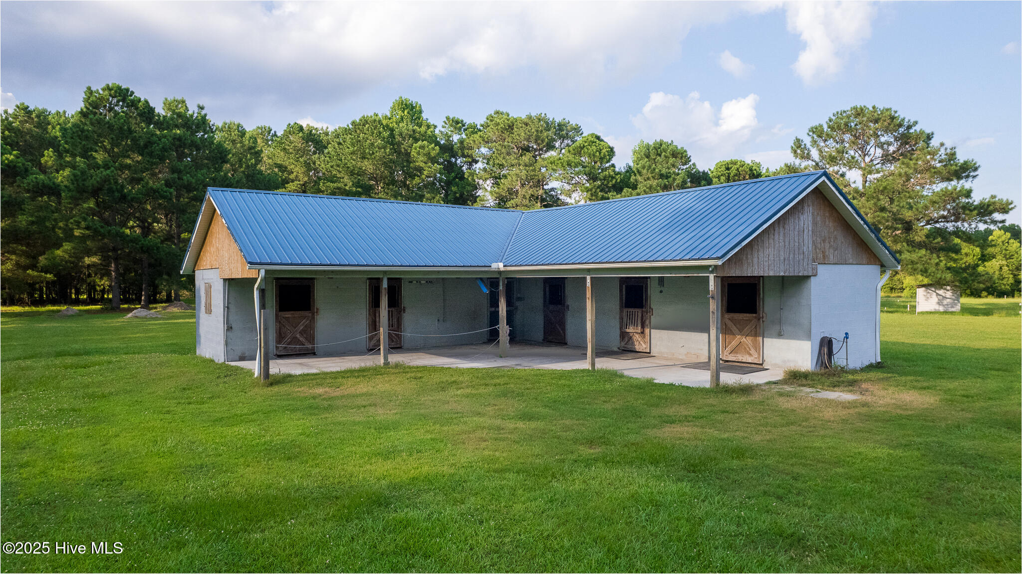 161 Howard Lane Swansboro, NC 28584 - Photo 29 of 56 Horse Stable includes 5 stalls and a tack room with a fly-deterrent system, electricity, and running water. Ample room for hay steaming.
