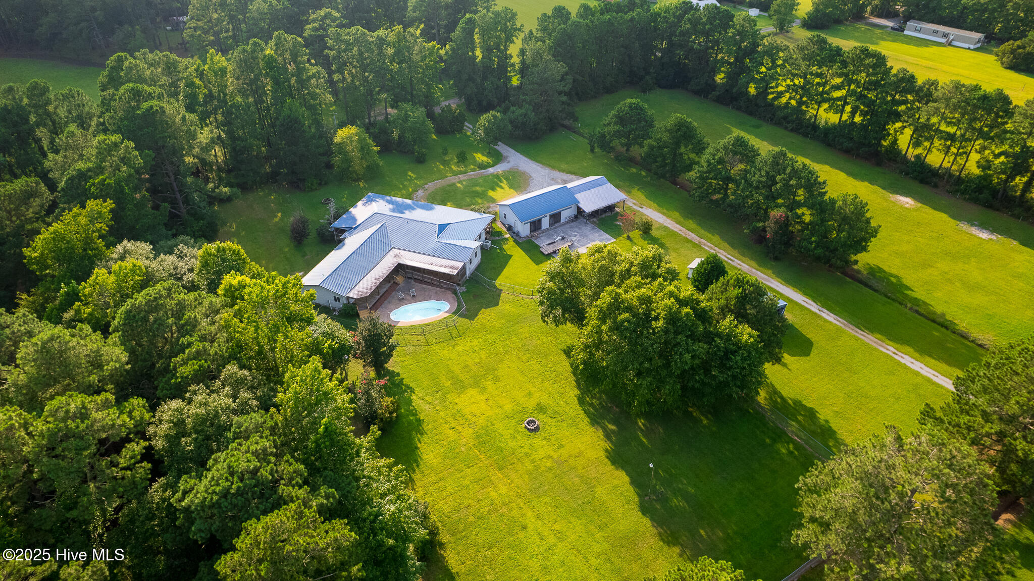 161 Howard Lane Swansboro, NC 28584 - Photo 34 of 56 Residence, detached garage, and two fully enclosed pastures along front of property