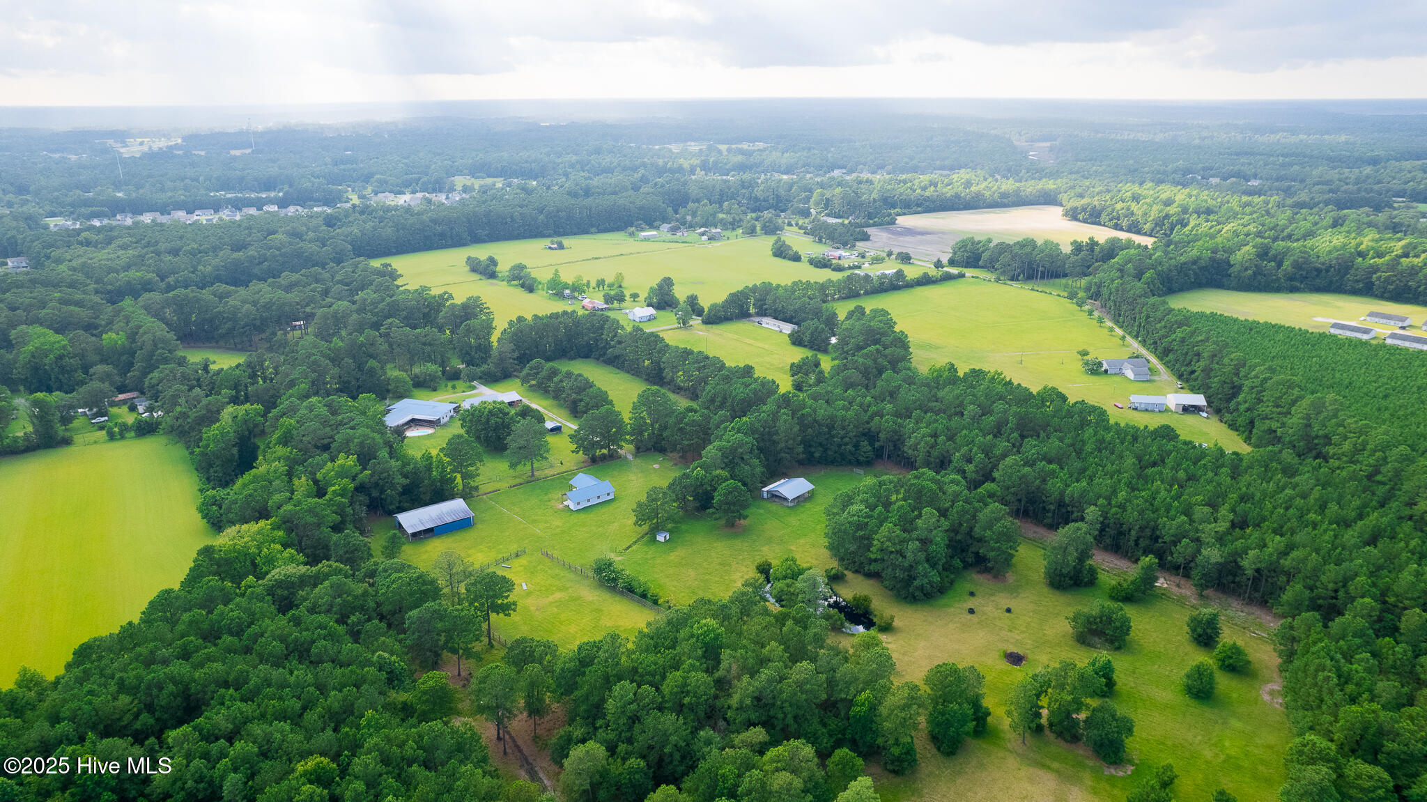 161 Howard Lane Swansboro, NC 28584 - Photo 36 of 56 Almost three sides of the lush property are bordered by substantial woods with plenty of trees for shade inside pastures.