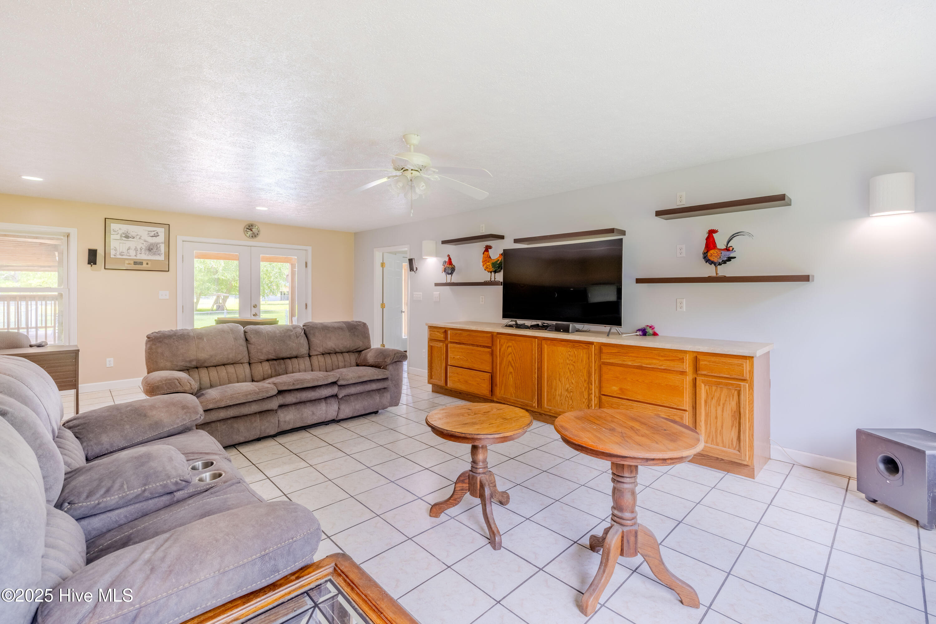 161 Howard Lane Swansboro, NC 28584 - Photo 45 of 56 Entertainment cabinetry matches cabinets in dining and kitchen.