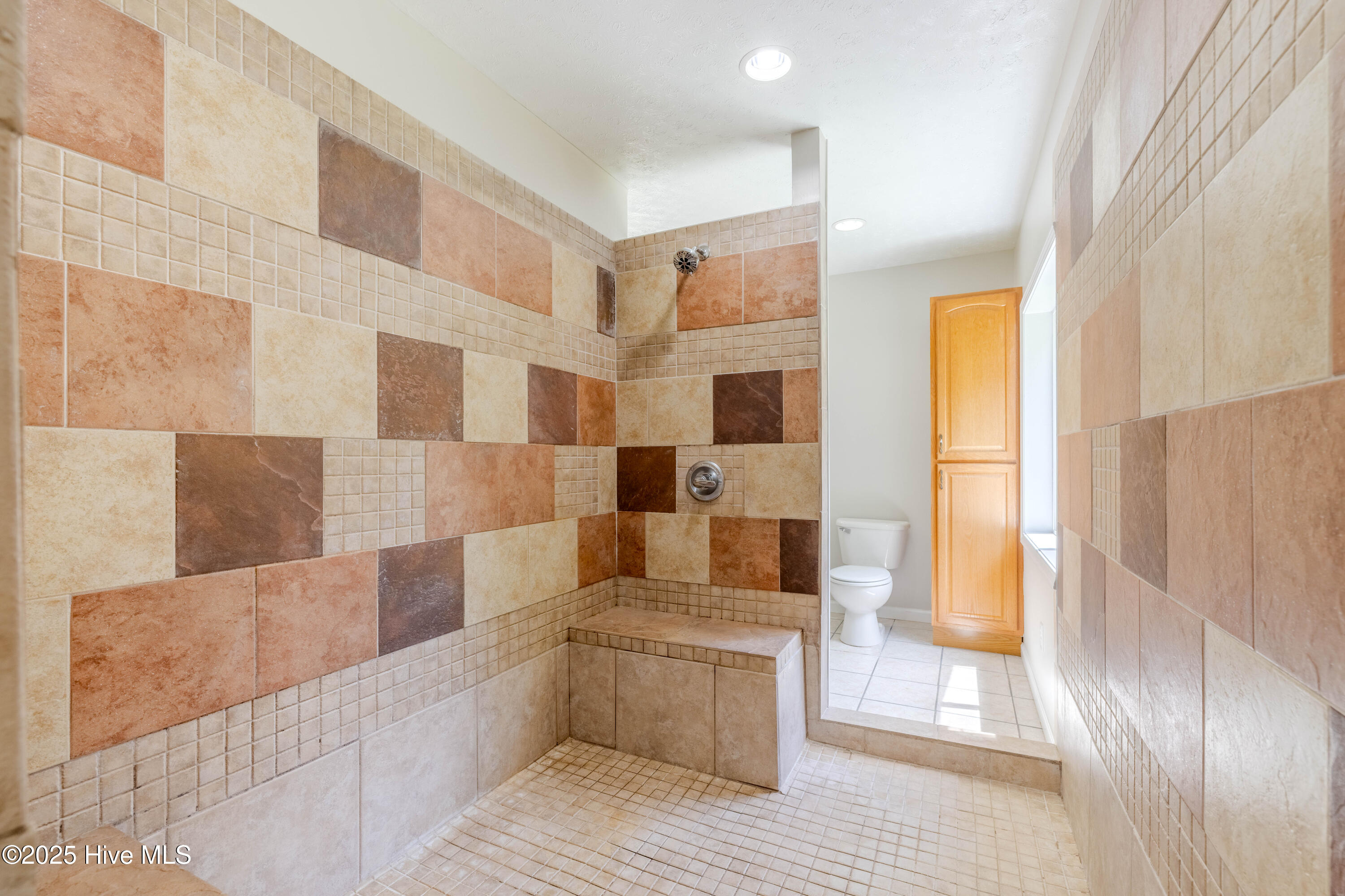 161 Howard Lane Swansboro, NC 28584 - Photo 49 of 56 Generous walk-in shower connects the "His" and "Hers" bathrooms.