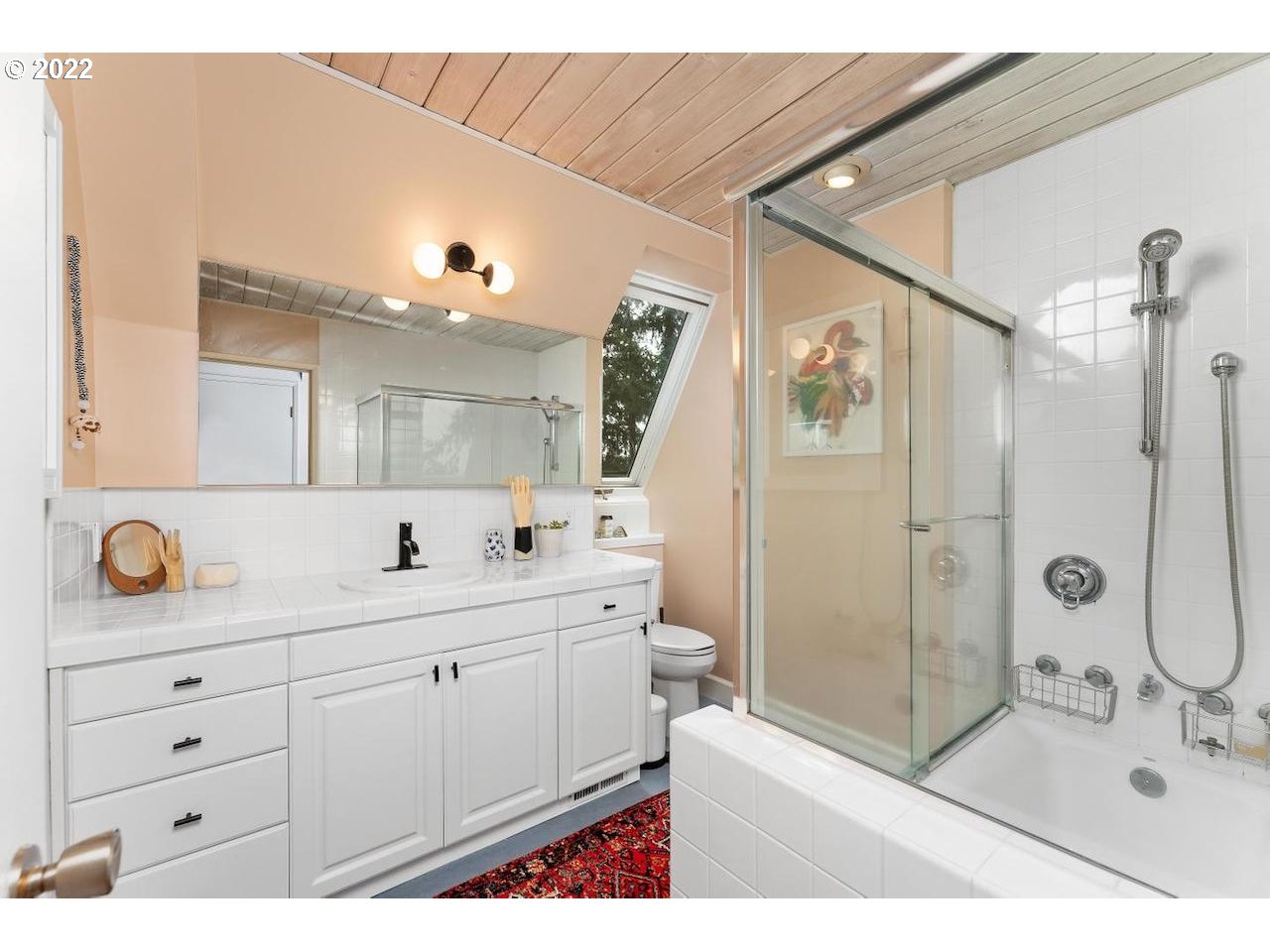 10668 Southwest 41st Avenue Portland, OR 97219 - Photo 17 of 32 a bathroom with a double vanity sink mirror and shower