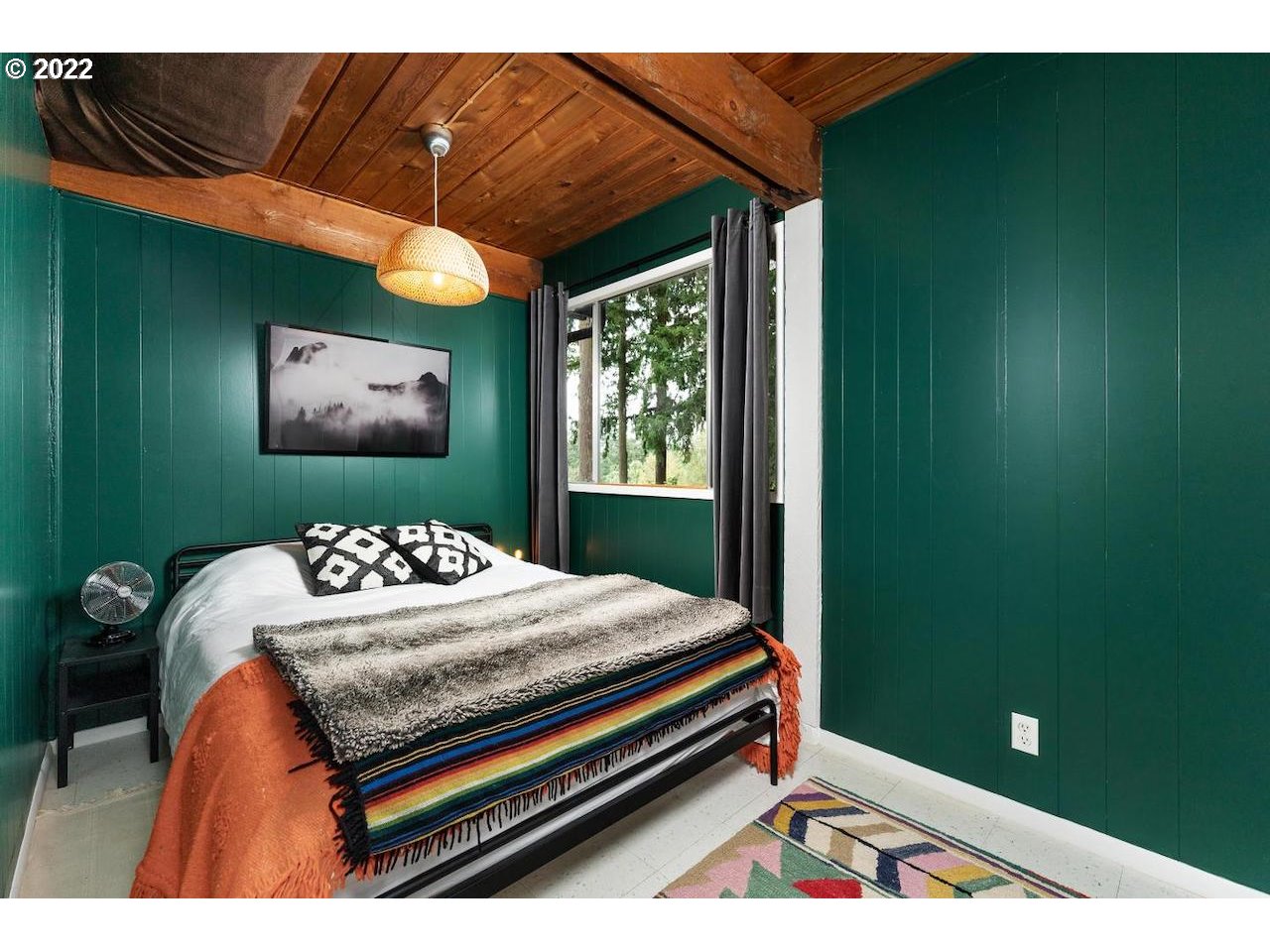 10668 Southwest 41st Avenue Portland, OR 97219 - Photo 20 of 32 a bedroom with a bed and a window