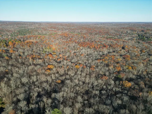 an aerial view of beach and residential space