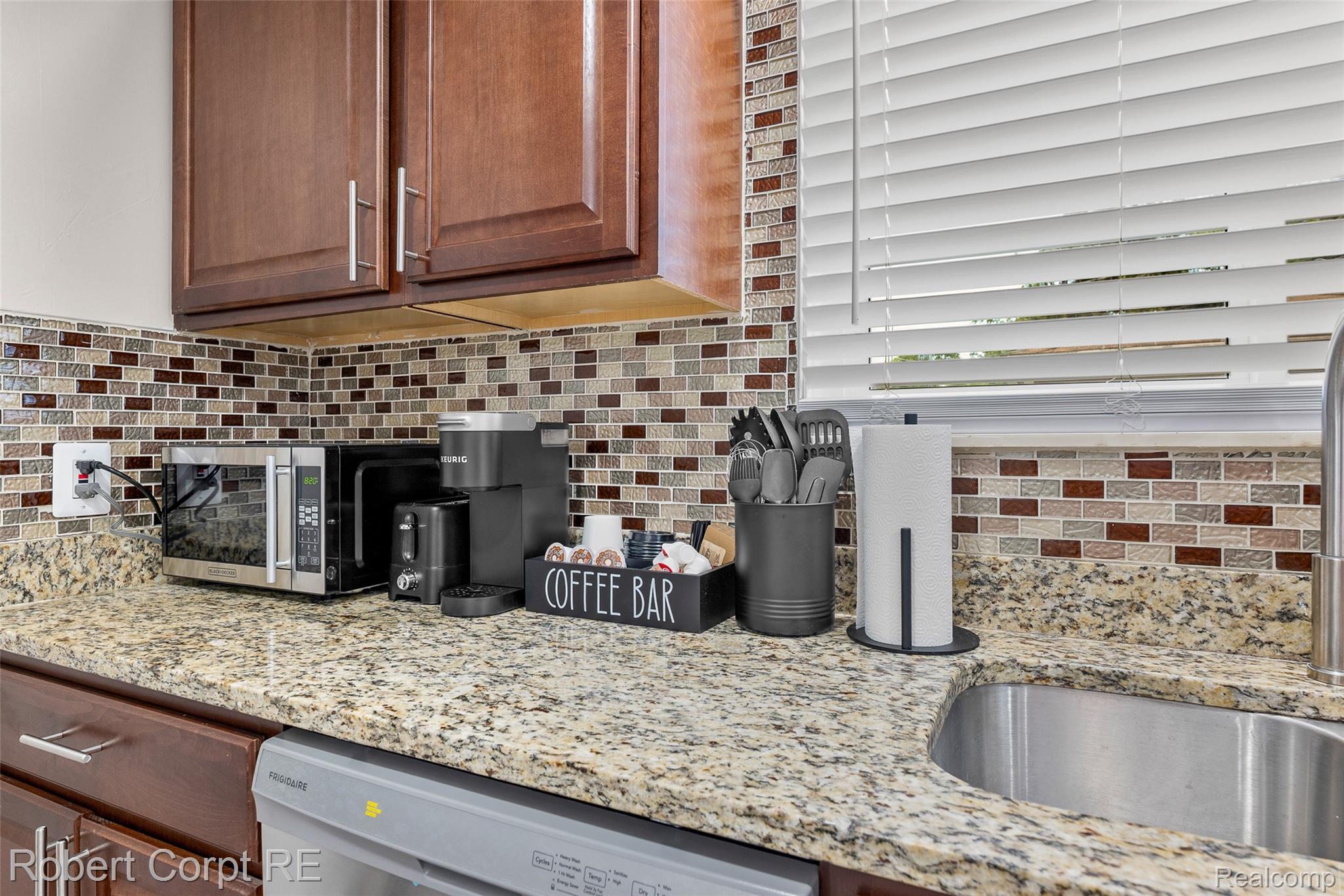 4772 Harding Street Dearborn Heights, MI 48125 - Photo 4 of 22 Kitchen with light stone countertops, stainless steel appliances, and backsplash