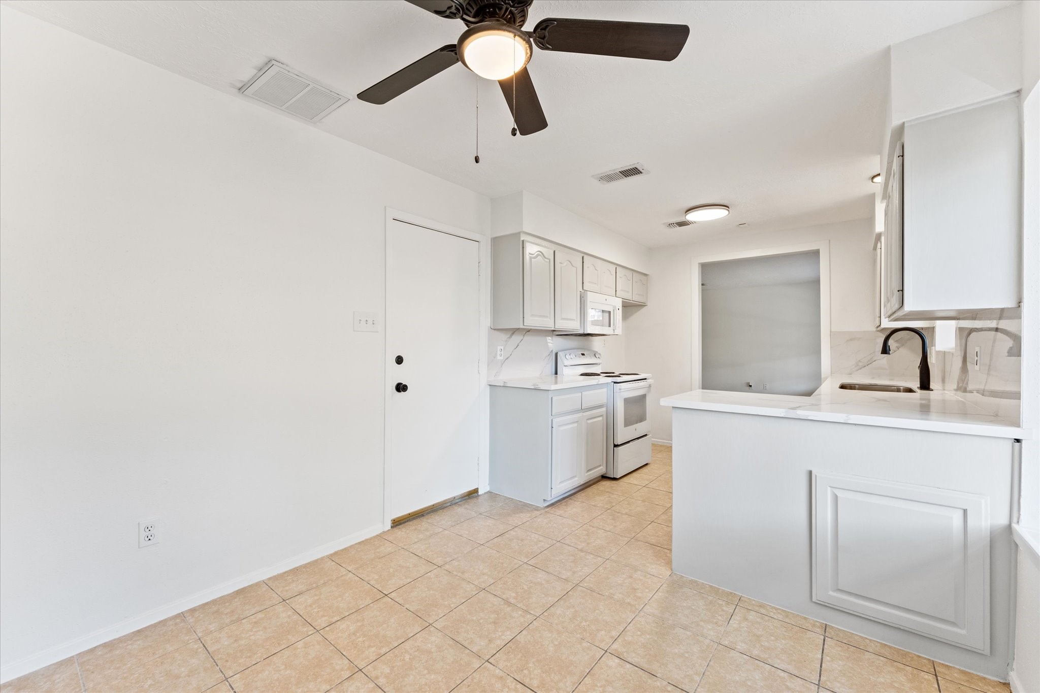 23122 Cimber Lane Spring, TX 77373 - Photo 12 of 25 a kitchen with a sink cabinets and window