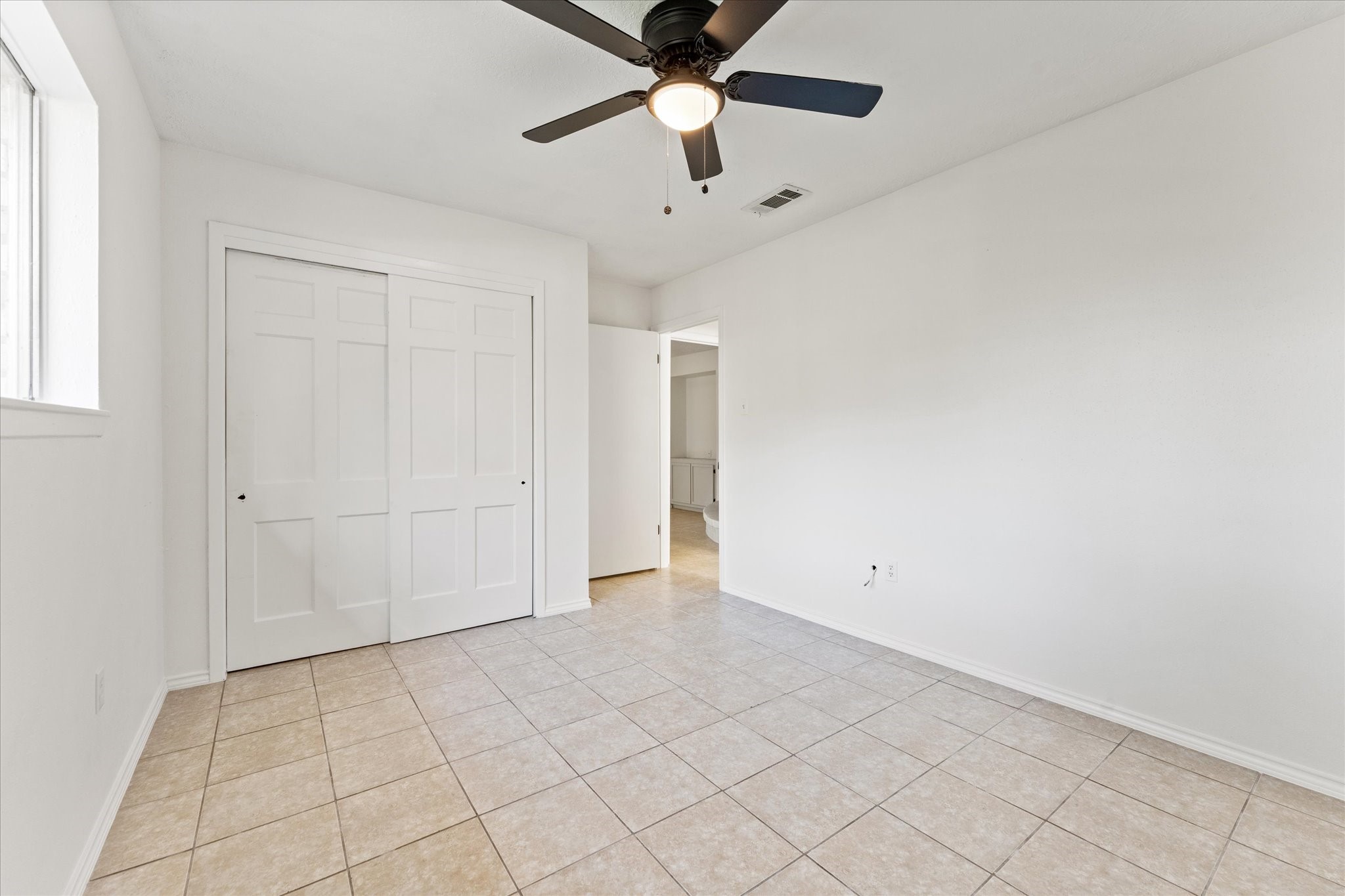 23122 Cimber Lane Spring, TX 77373 - Photo 15 of 25 an empty room with chandelier fan