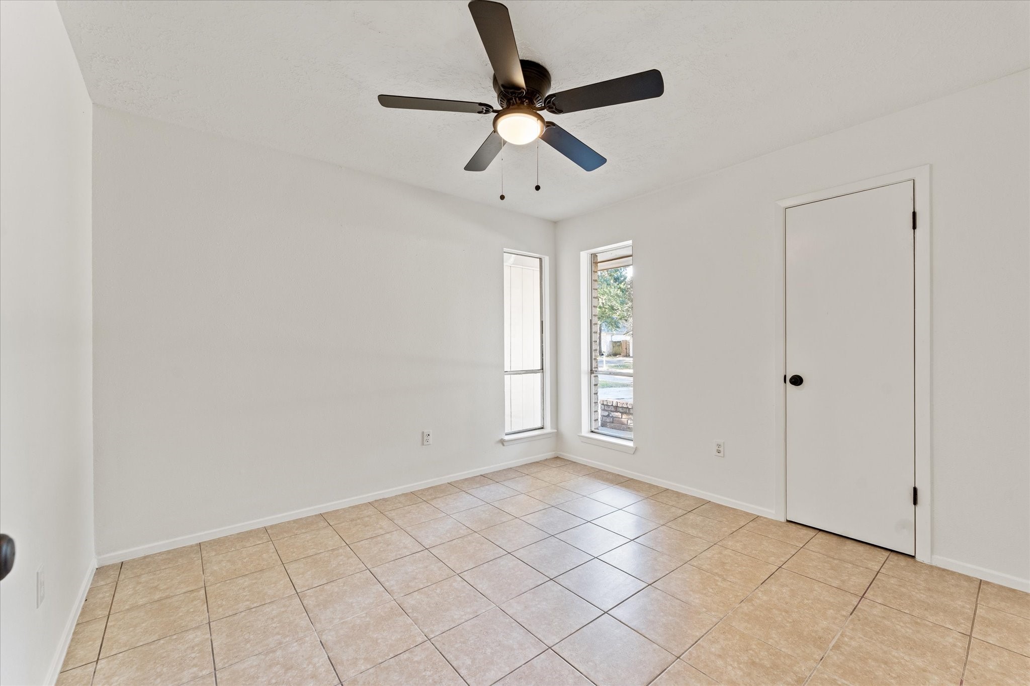 23122 Cimber Lane Spring, TX 77373 - Photo 17 of 25 an empty room with fan and windows