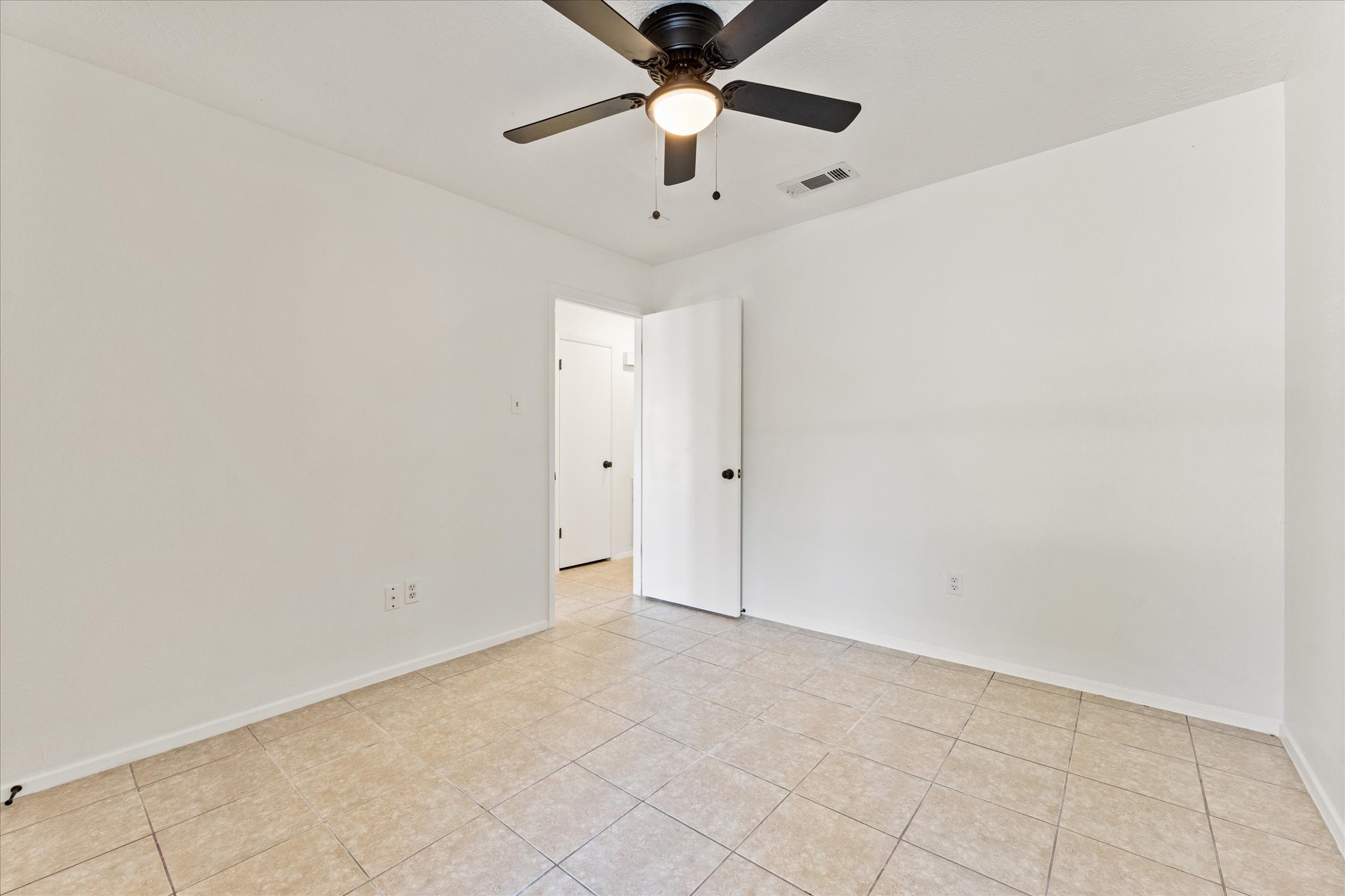 23122 Cimber Lane Spring, TX 77373 - Photo 18 of 25 an empty room with chandelier fan