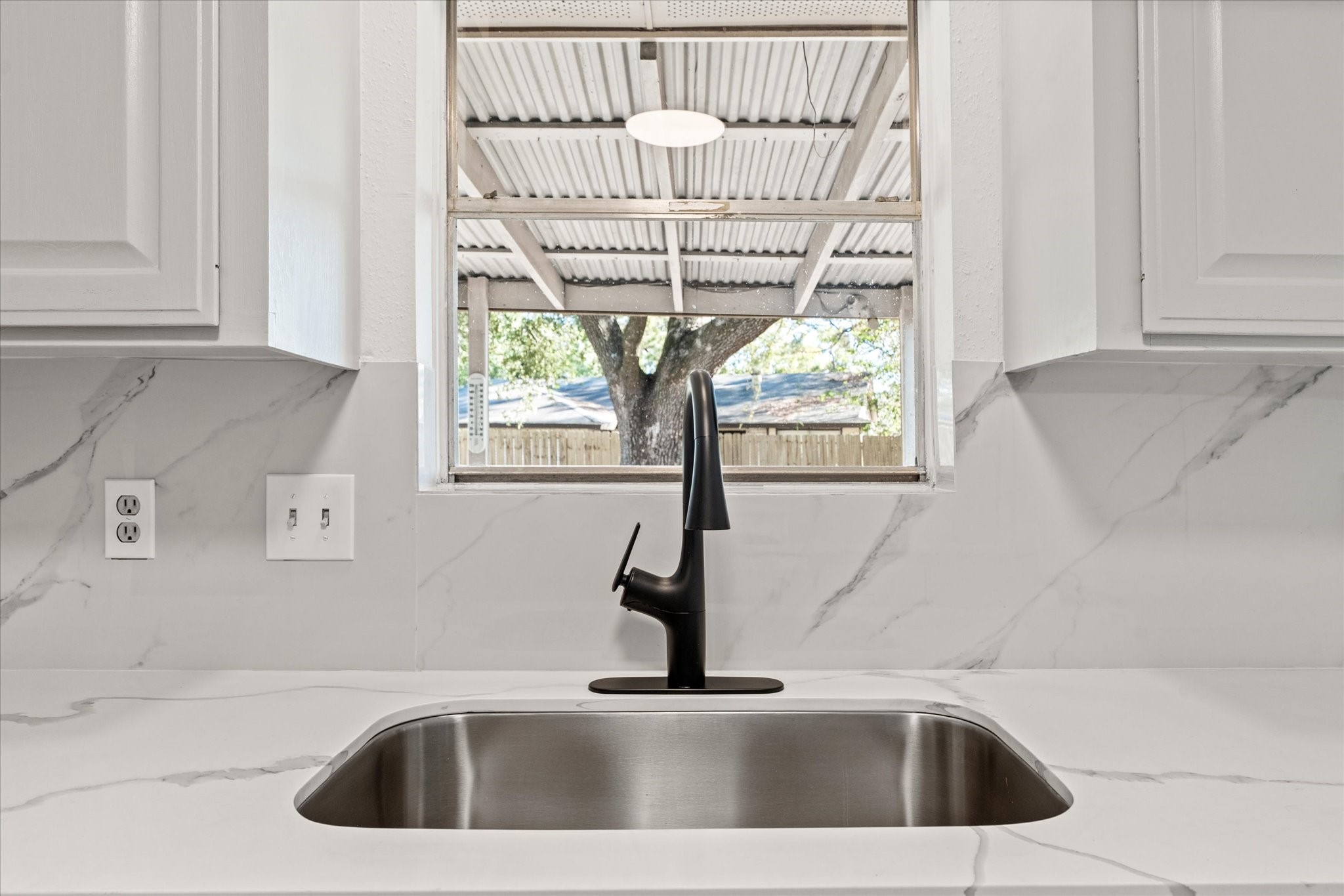 23122 Cimber Lane Spring, TX 77373 - Photo 8 of 25 a kitchen with a sink and a window