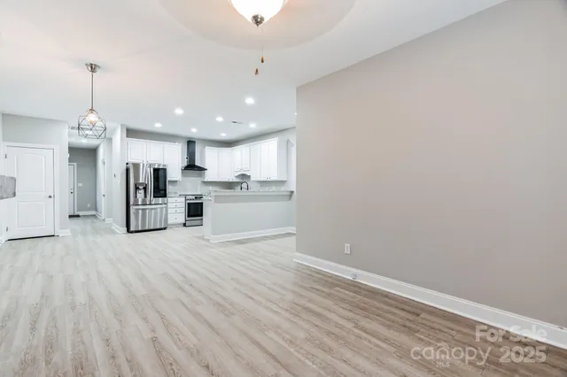 a view of kitchen with wooden floor