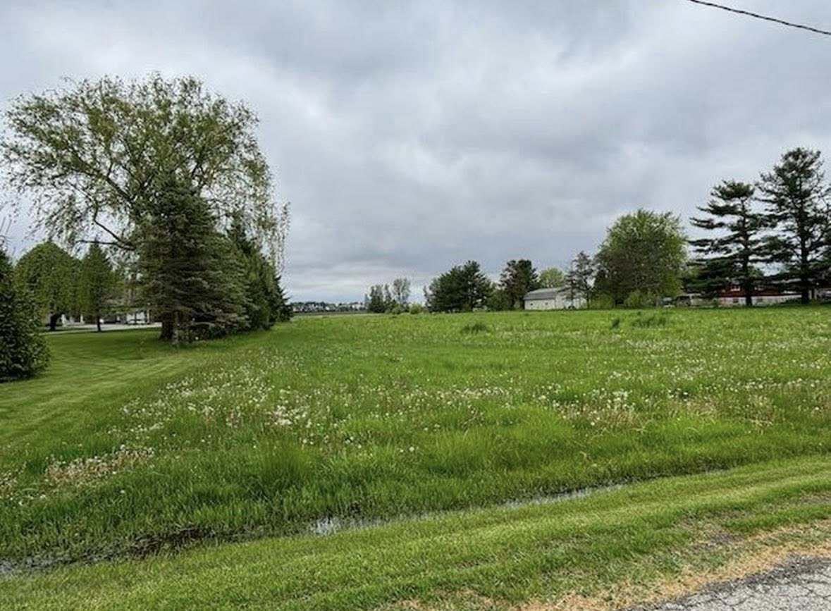 - Regnier Road Hebron, IL 60034 - Photo 2 of 3 a backyard of a house with lots of green space