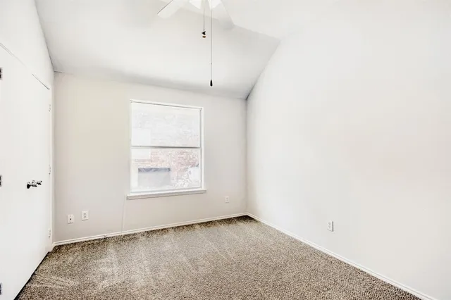 an empty room with a empty space and windows