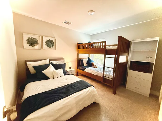 a bedroom with bed and window