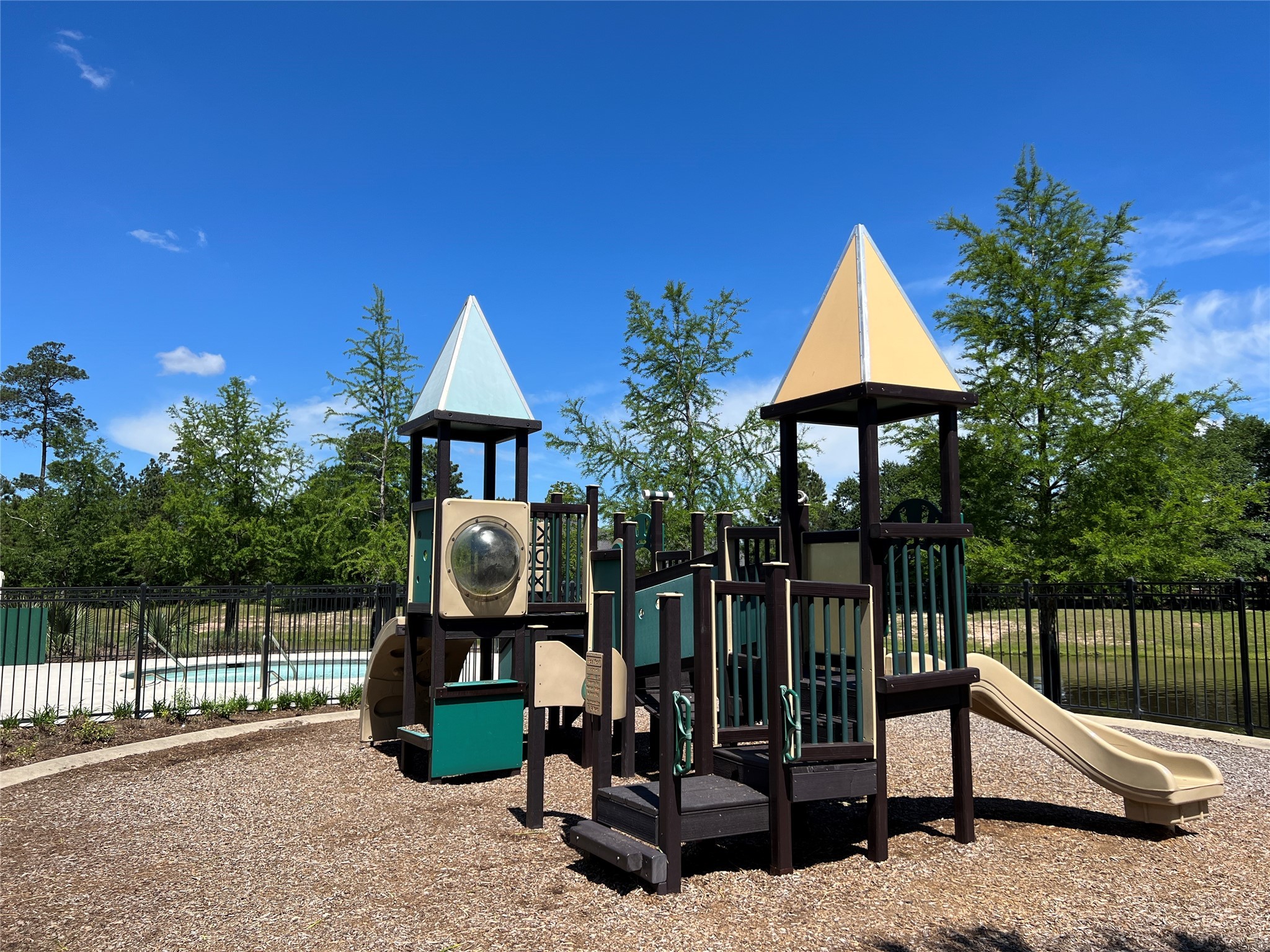 10542 Preserve Way Conroe, TX 77385 - Photo 20 of 26 a view of a park with iron fence