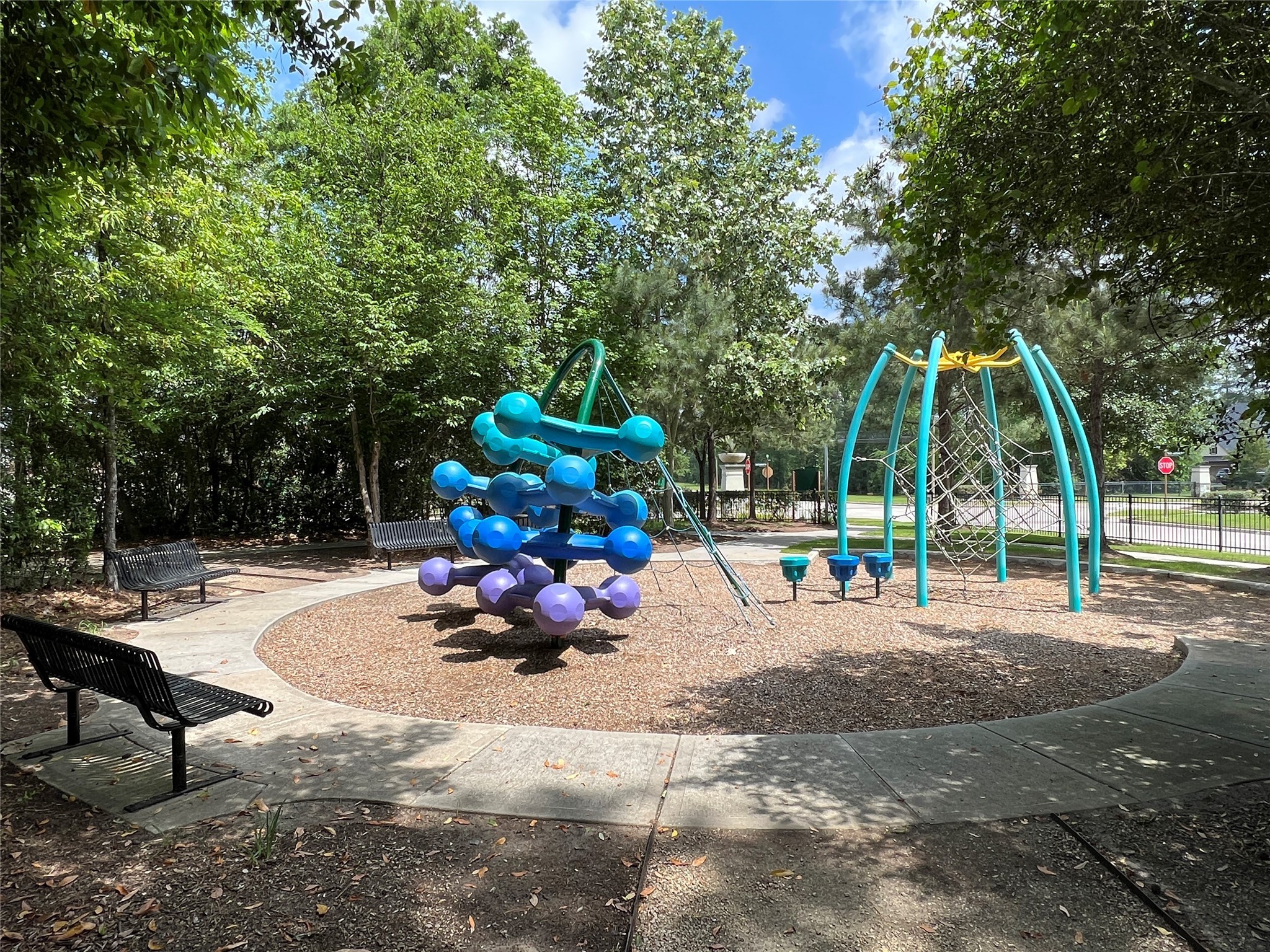 10542 Preserve Way Conroe, TX 77385 - Photo 21 of 26 a view of a park with swings and slides
