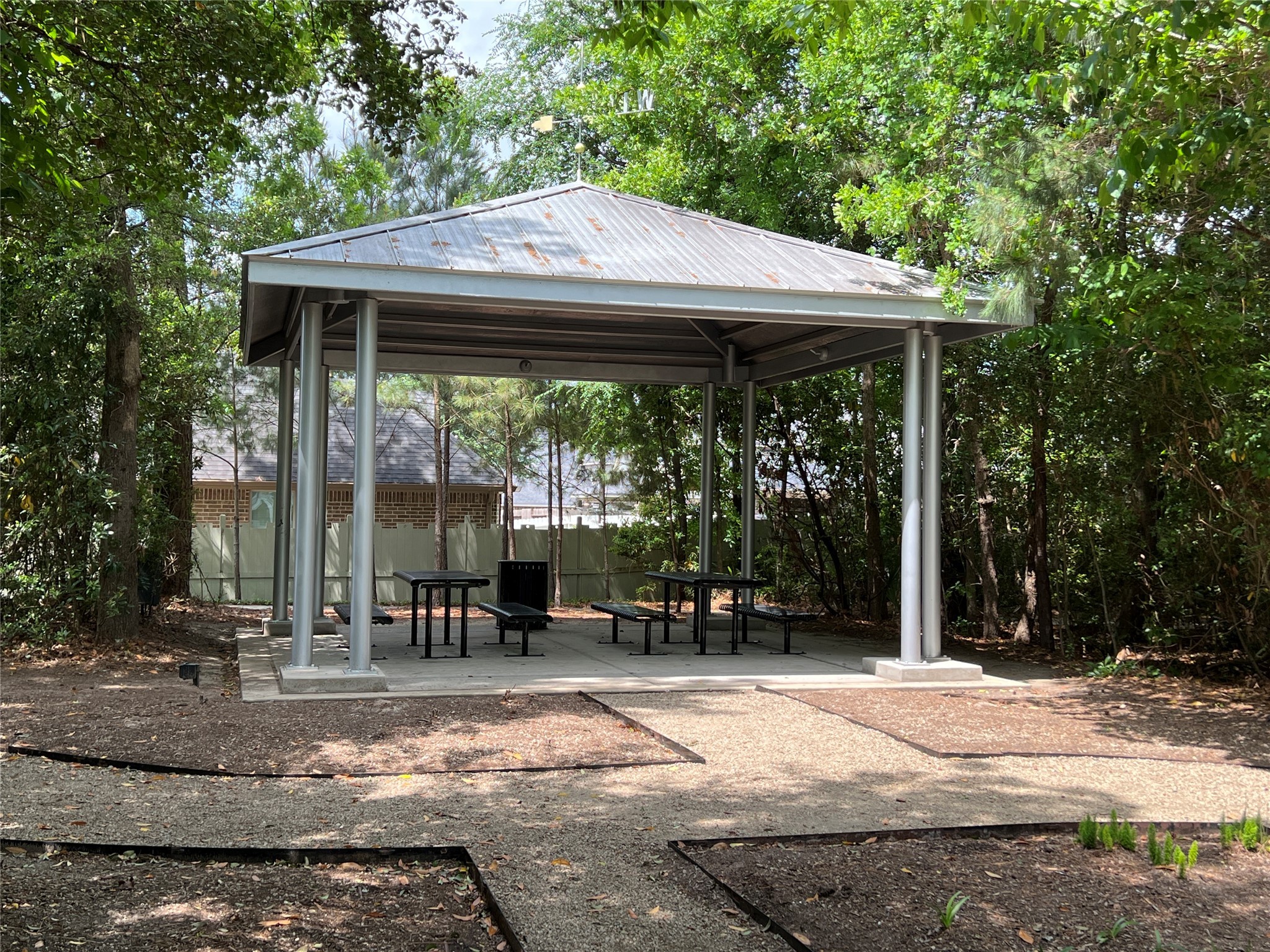 10542 Preserve Way Conroe, TX 77385 - Photo 23 of 26 a patio with table and chairs