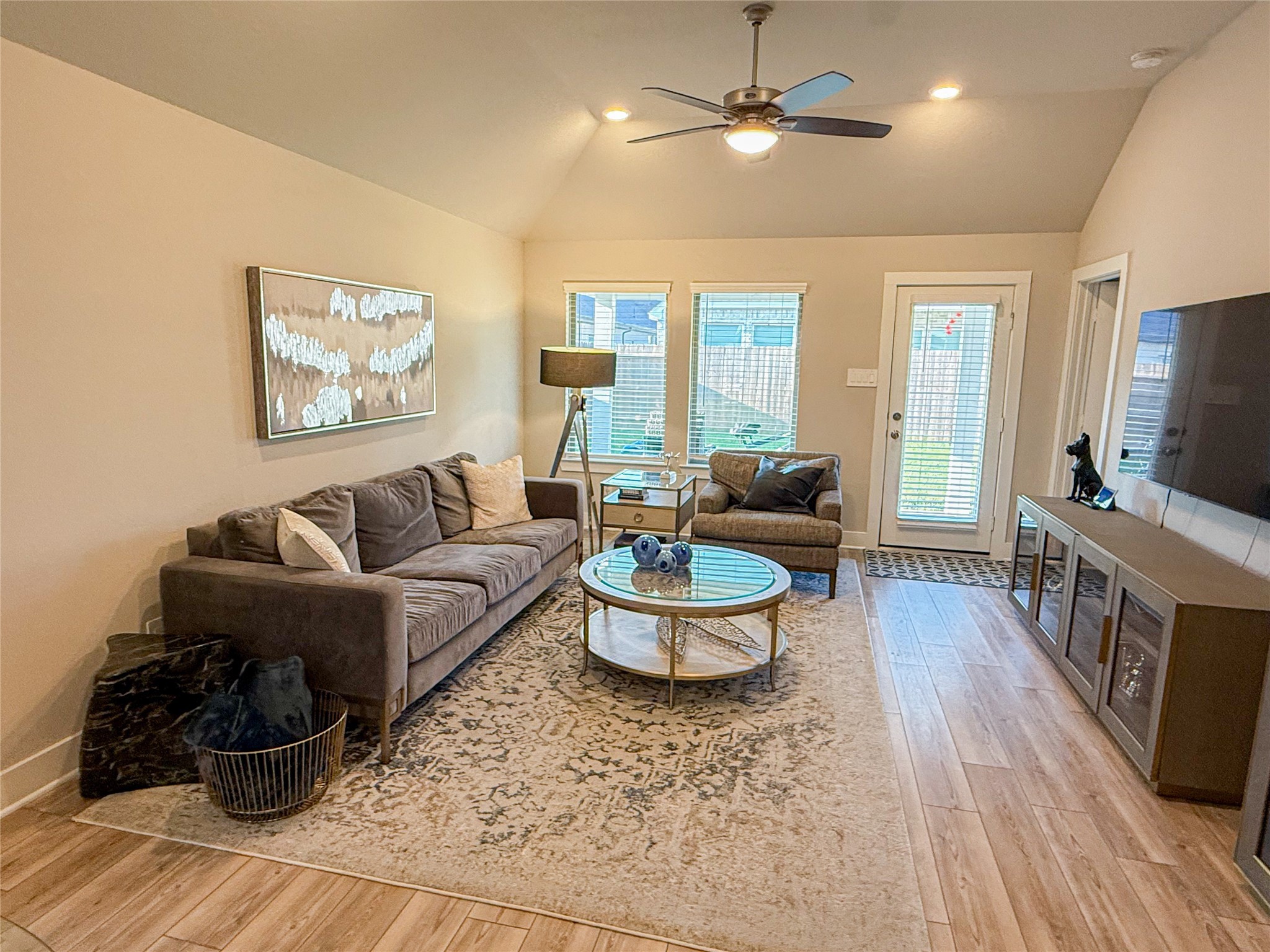 10542 Preserve Way Conroe, TX 77385 - Photo 8 of 26 a living room with furniture and a flat screen tv