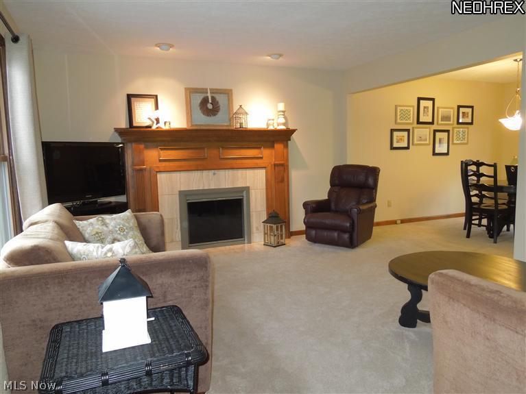 5909 Chestnut Road Independence, OH 44131 - Photo 3 of 15 Living Room from the Foyer! Fireplace with Newer Fireplace doors and Wood Mantle with tile Hearth!