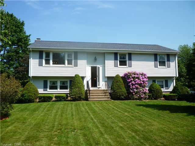 670 Wiese Road Cheshire, CT 06410 - Photo 1 of 1 a front view of a house with a yard