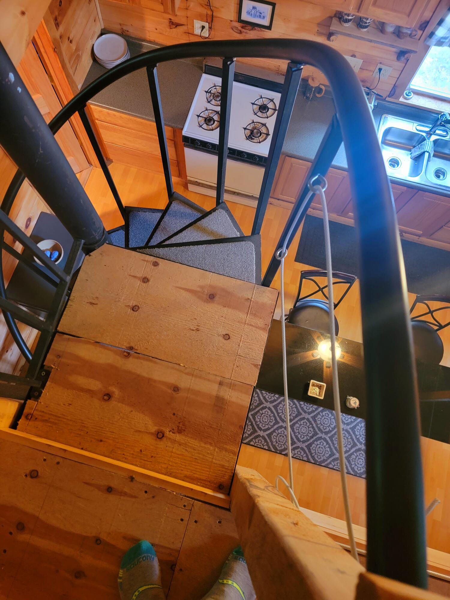 1290 New Portland Road Embden, ME 04958 - Photo 22 of 34 spiral stair case to lofts