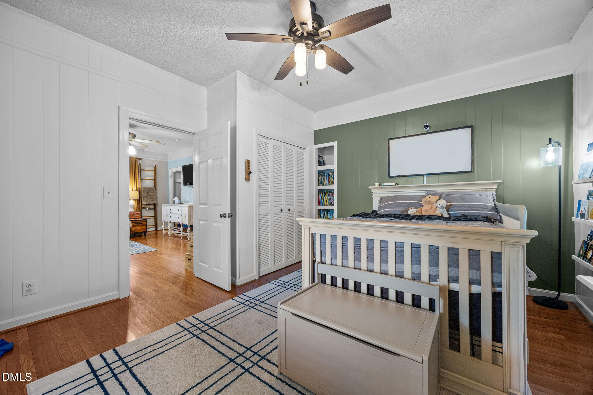203 North 11th Street Erwin, NC 28339 - Photo 15 of 27 a bedroom with furniture and wooden floor