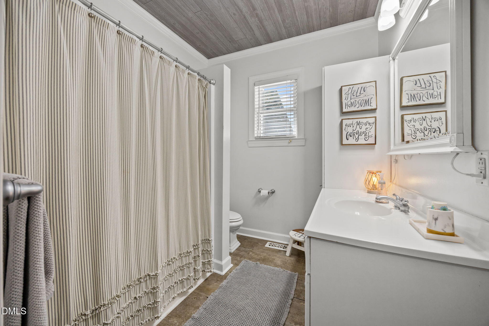 203 North 11th Street Erwin, NC 28339 - Photo 19 of 27 a bathroom with a sink and a mirror