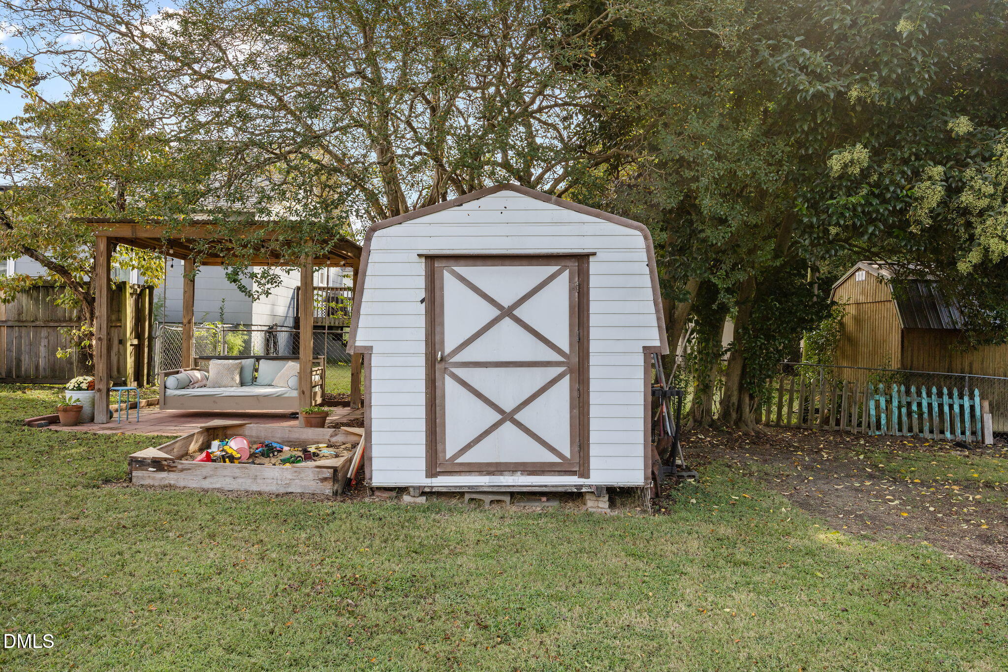 203 North 11th Street Erwin, NC 28339 - Photo 25 of 27 a front view of a house with garden